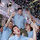 Joyous postal workers congratulate themselves on another job well done.